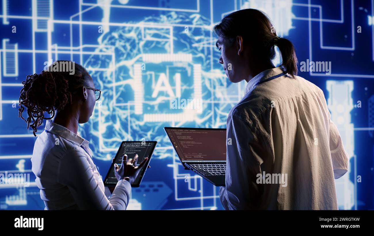 IT team members develop artificial intelligence neural networks ...