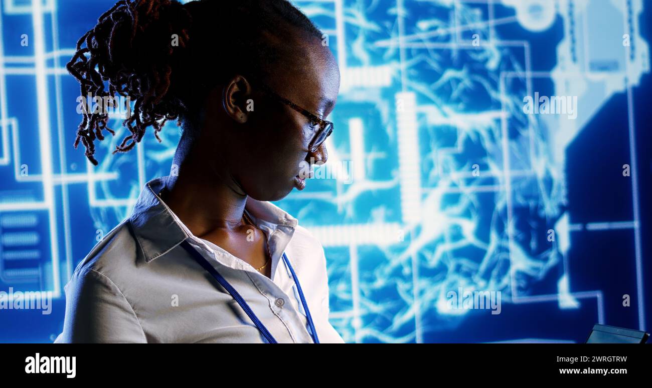 Portrait of smiling african american developer programming scripts on ...