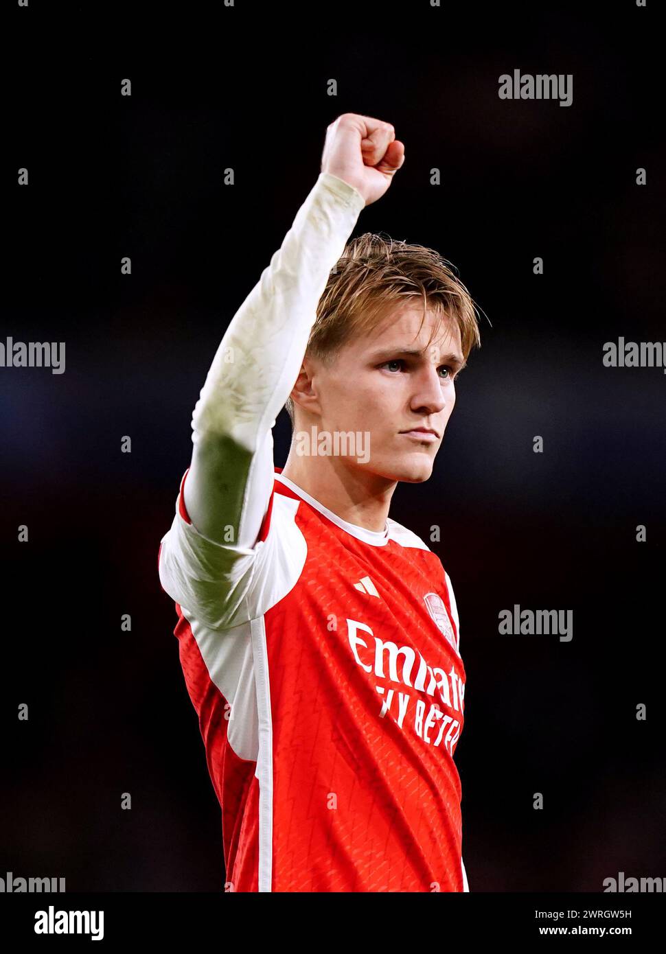 Arsenal's Martin Odegaard gestures to the fans at the end of the UEFA Champions League Round of 16, second leg match at the Emirates Stadium, London. Picture date: Tuesday March 12, 2024. Stock Photo