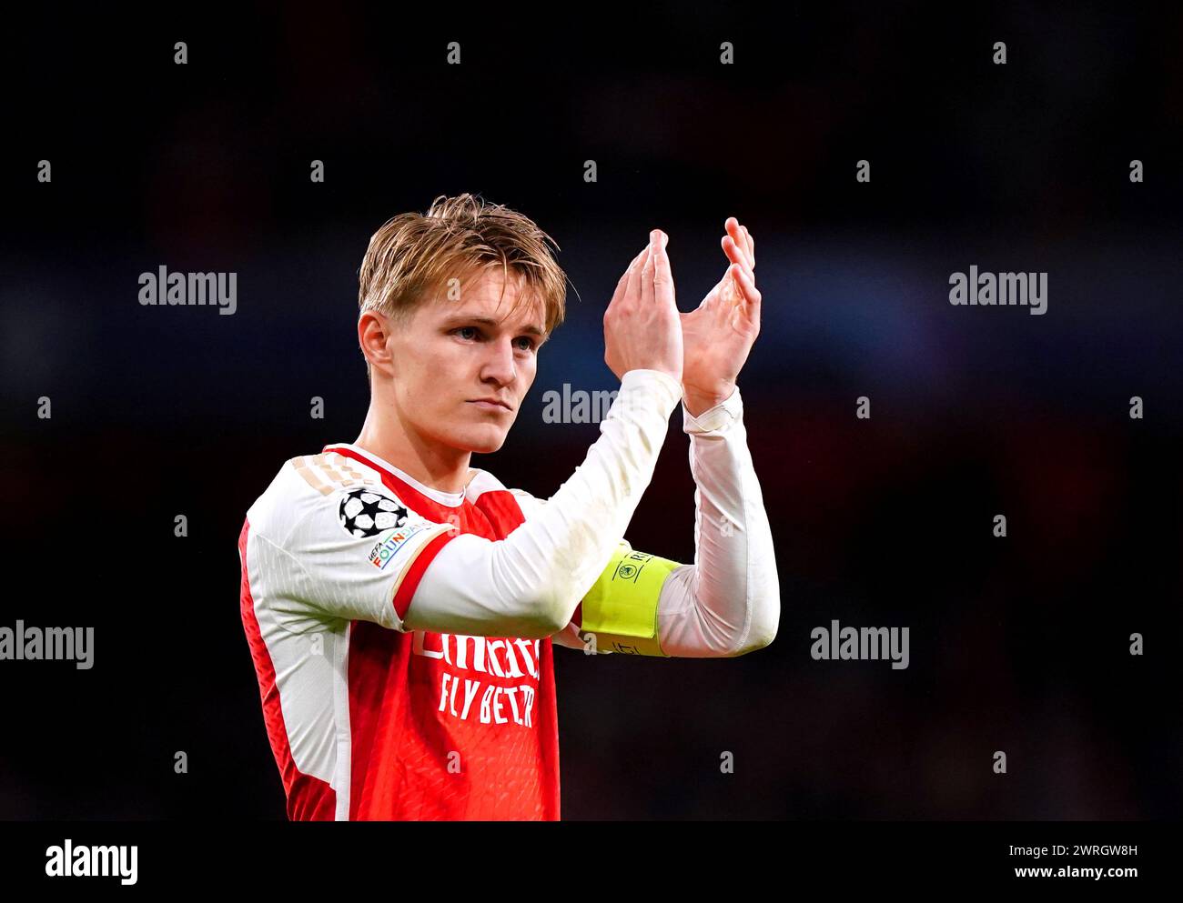 Arsenal's Martin Odegaard applauds the fans at the end of the UEFA Champions League Round of 16, second leg match at the Emirates Stadium, London. Picture date: Tuesday March 12, 2024. Stock Photo