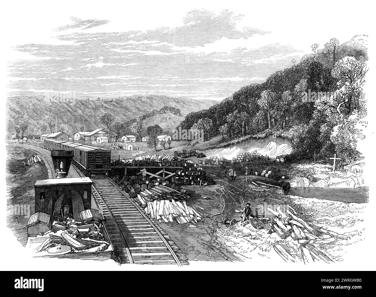 Railway Station at the Franklin Petroleum Oil Works, Pennsylvania, 1864. 'The casks or barrels of crude oil are conveyed from the Franklin and Titusville stations by the Atlantic and Great Western Railway...Two hundred miles of railway were constructed in as many days before the end of 1862, and 145 miles were added [in] 1863. The line is now opened throughout its entire length, traversing the fertile States of Pennsylvania and Ohio, and enabling goods or passengers to travel from New York to St. Louis, near the confluence of the Mississippi and Missouri, without a change of carriage...During Stock Photo