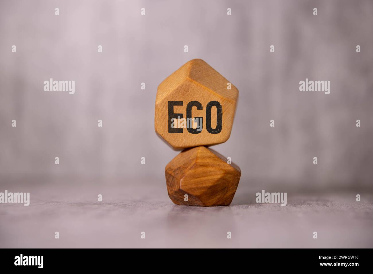 The word ego written in cubes on a wooden background Stock Photo