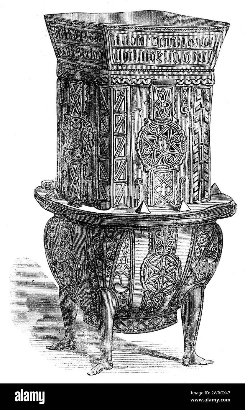 The Loan Collection, South-Kensington, 1862. 'The &quot;Dunvegan Cup,&quot; a cup or &quot;mether&quot; of yew, square above and rounded from the centre downwards, covered with silver mounts gilt and nielloed, decorated with repouss&#xe9; and filigree work, standing on four rudely-formed representations of human legs, covered with silver, the shoes nielloed; round the mouth is a rim of silver 2in. deep, on the outside of which is engraved an inscription in black letter, which has been read as follows by Mr. Eugene Curry: &quot;Katherina ingen in Neill (O'Neill's daughter) uxor Johannis Mcguigh Stock Photo