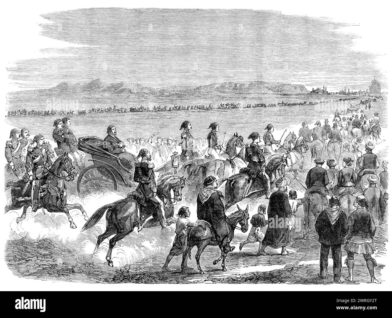 Returning from the races at Cairo, 1864. Engraving from a sketch by Mr. Frederick George, '...of a truly English sport held under most un-English conditions...This scene...differs essentially, in the matters of locality and costume, from a return from Epsom or Ascot. The hills in the distance are known as the Mokatem. At the end of the range may be distinguished the citadel, with its grand mosque, the most striking feature in the panorama of Cairo. To this point the multitude, broken into long streams, are making their way. Conspicuous amongst all in this motley assemblage is the glittering ca Stock Photo
