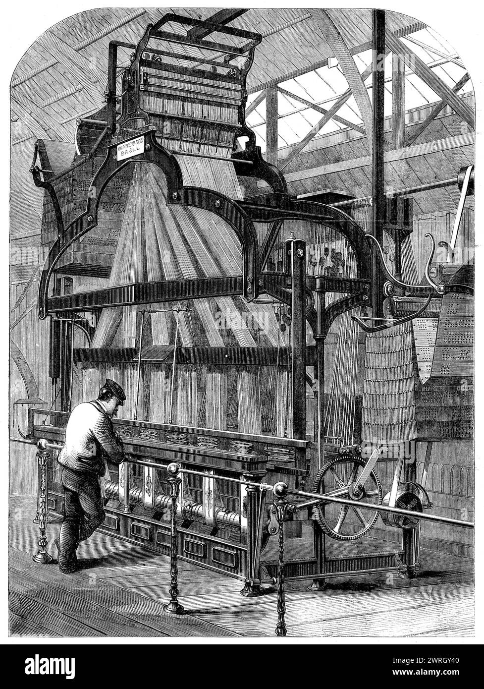 The International Exhibition: Swiss jacquard-loom for weaving ribbons - from a photograph by the London Stereoscopic Company, 1862. 'This machine...is employed in weaving eight broad silk ribbons at one time. The pattern of the ribbon is a continual repetition of the Royal arms of England, done in brilliant colours on a white silk ground...it appears a huge mass of delicate machinery, threads, perforated cards...&amp;c...it is...eight single looms in one, and consequently its parts are eight times as numerous...there is a warp of blue and white silk, and a weft of white silk: these two make th Stock Photo
