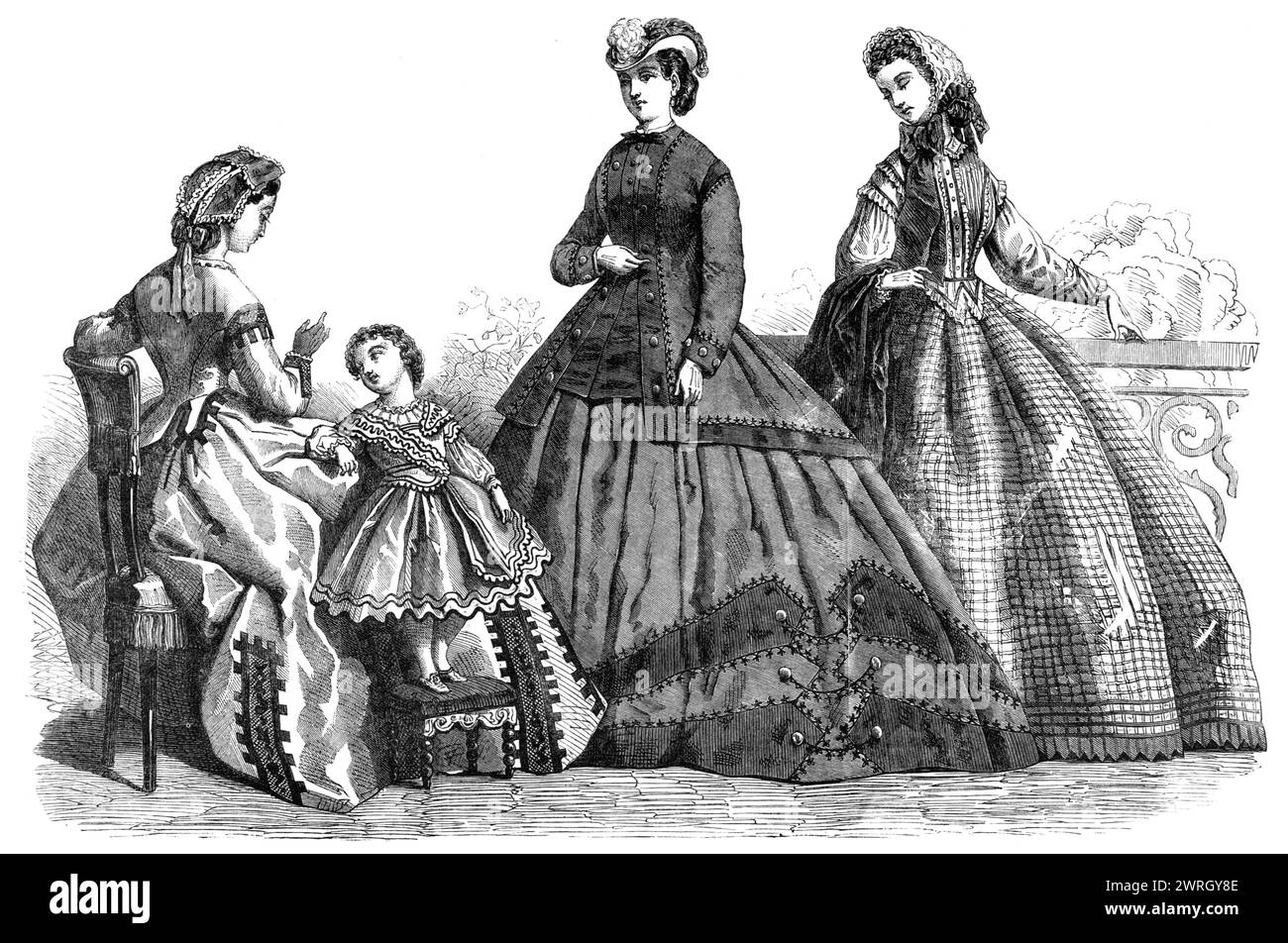 Paris fashions for October, 1864. 'Fig. 1. Evening Dress. Robe of white alpaca, ornamented with black lace insertion...Muslin chemisette, with collar and cuffs of embroidered muslin. The head-dress is composed of a wide entredeux, trimmed with narrow guipure over rose-coloured silk, terminated by a rose-coloured silk bow and ends. Fig. 2. Dress for a Little Boy. Low-necked nankeen blouse, trimmed with black worsted braid; the rounded teeth on the edge of the skirt are bordered with black binding. Wide sleeves, with a band descending from the shoulder...Fig. 3. Dress for a Young Lady. Checkered Stock Photo