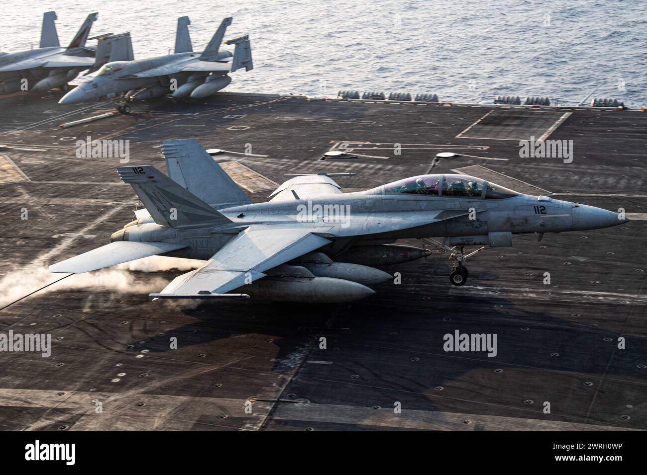 SOUTH CHINA SEA (March 7, 2024) An F/A-18F Super Hornet from the “Black Knights” of Strike Fighter Squadron (VFA) 154 lands on the flight deck Stock Photo