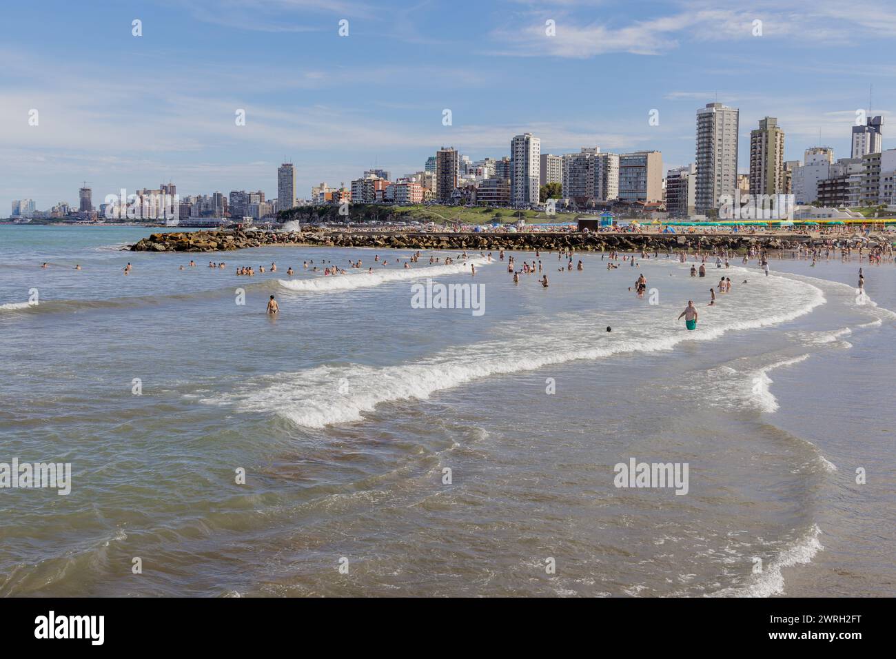 Mar del Plata, Argentina - January 15th, 2024: Tourists swimming at Stella Maris beach in Mar del Plata. Stock Photo