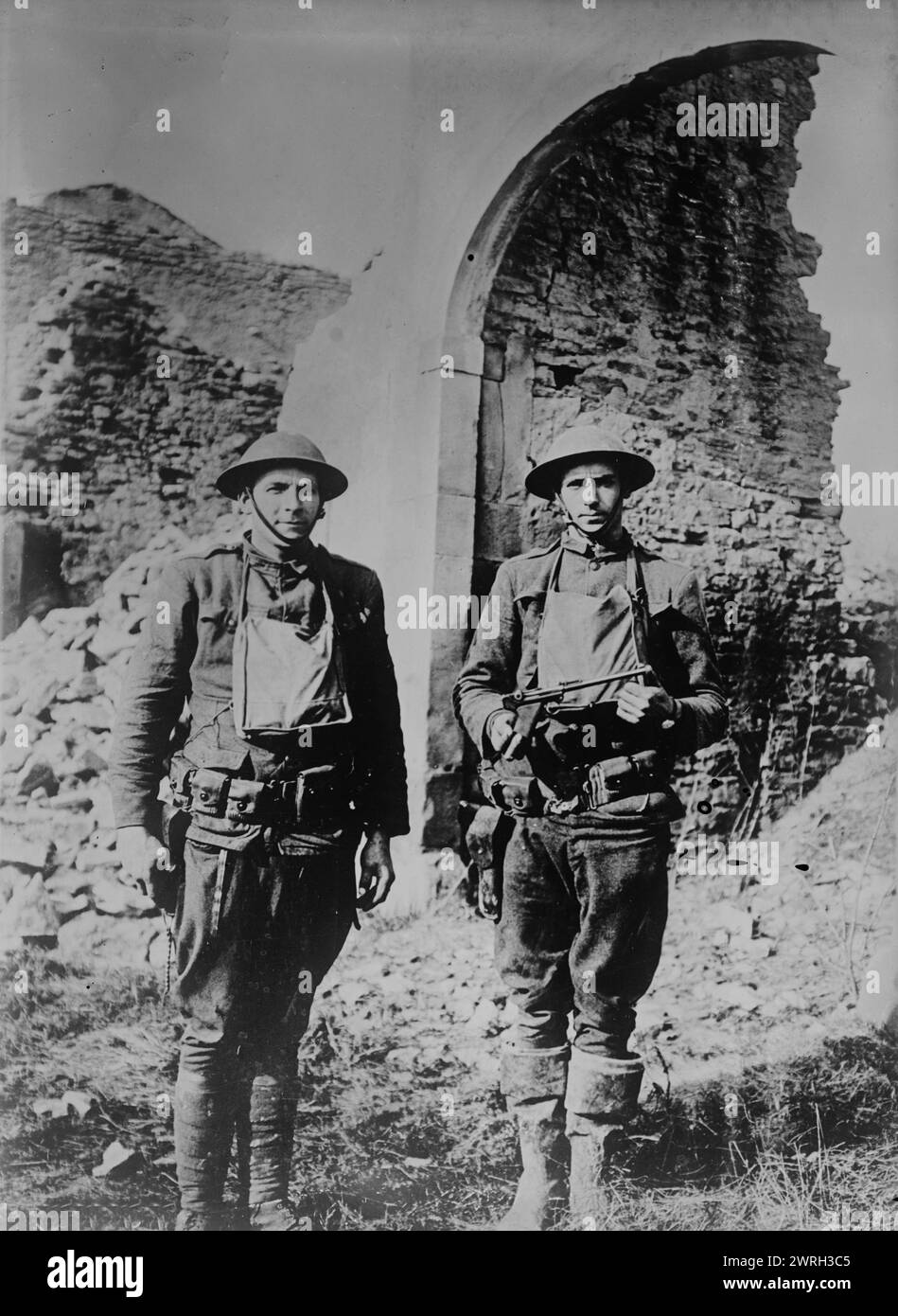 U.S. soldiers &amp; German pistol, 11 Mar 1918. Two American soldiers, Corporal Howard Thompson and James H. White who were part of a group that killed and captured several Germans in no man's land on March 7, 1918 during World War I. Thompson holds a pistol taken from a German soldier killed by White. Photograph was taken in Ancerviller, France, March 11, 1918. Stock Photo