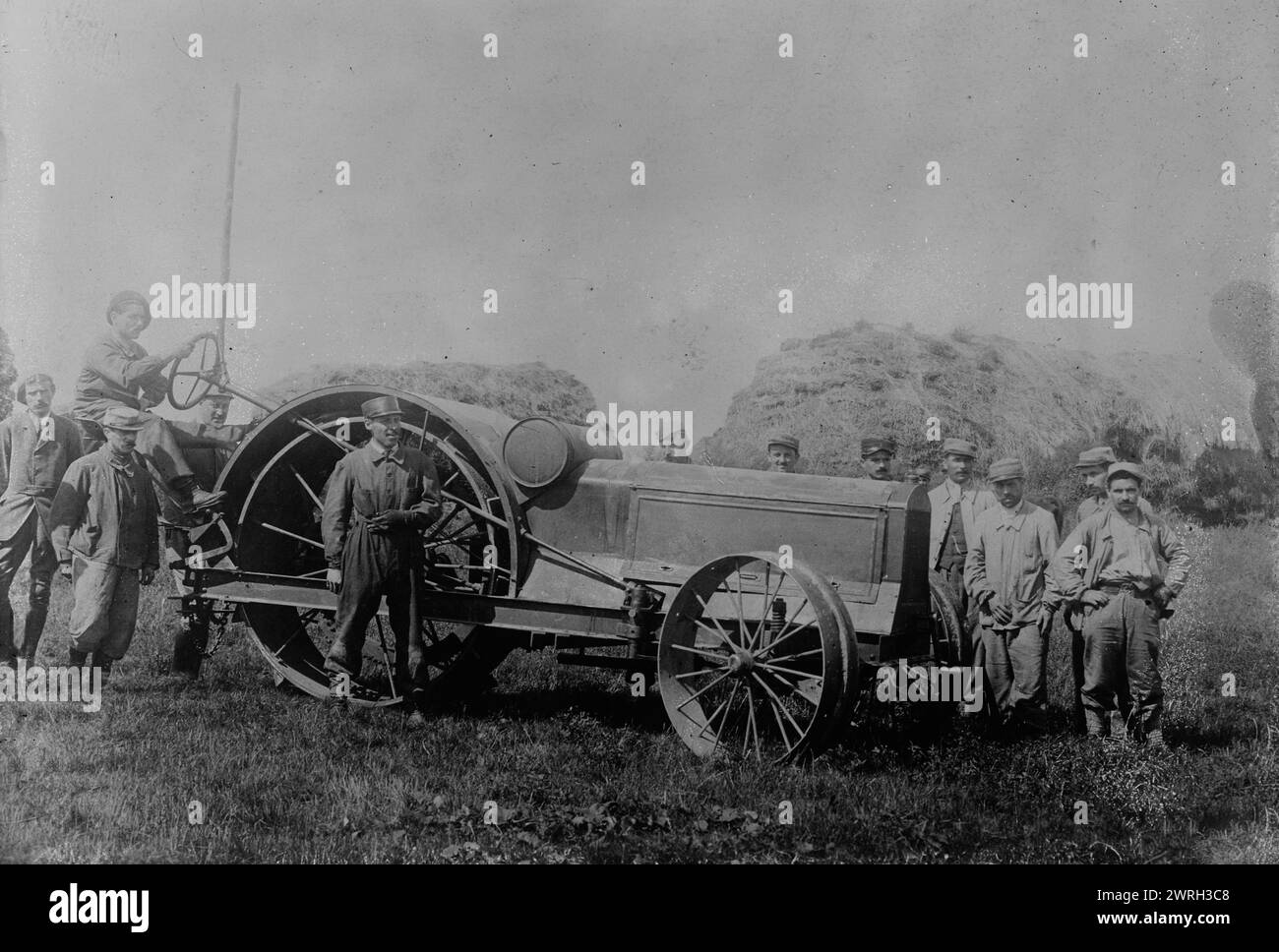 French cripples run a tractor, 17 May 1918 (date created or published later). Men operating a tractor, probably on an American Red Cross farm, established to assist French disabled veterans near Tours in 1918 during World War I. Stock Photo