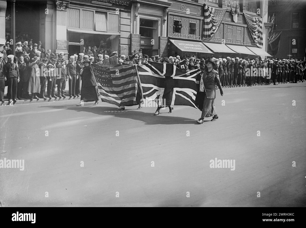 Liberty Parade, 1917 or 1918. Women with American and British flags marching in a parade to support Liberty bonds during World War I, New York City. Stock Photo