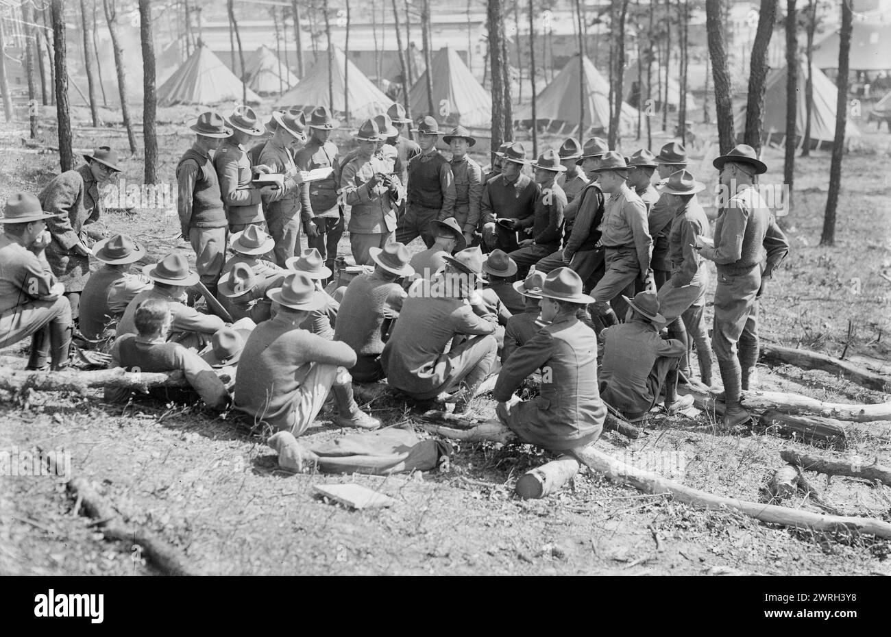 Learning pistol firing, Camp Upton, 15 Sept 1917 (date created or published later). Soldiers at Camp Upton, a U.S. Army installation located on Long Island, in Yaphank, New York during World War I. Stock Photo