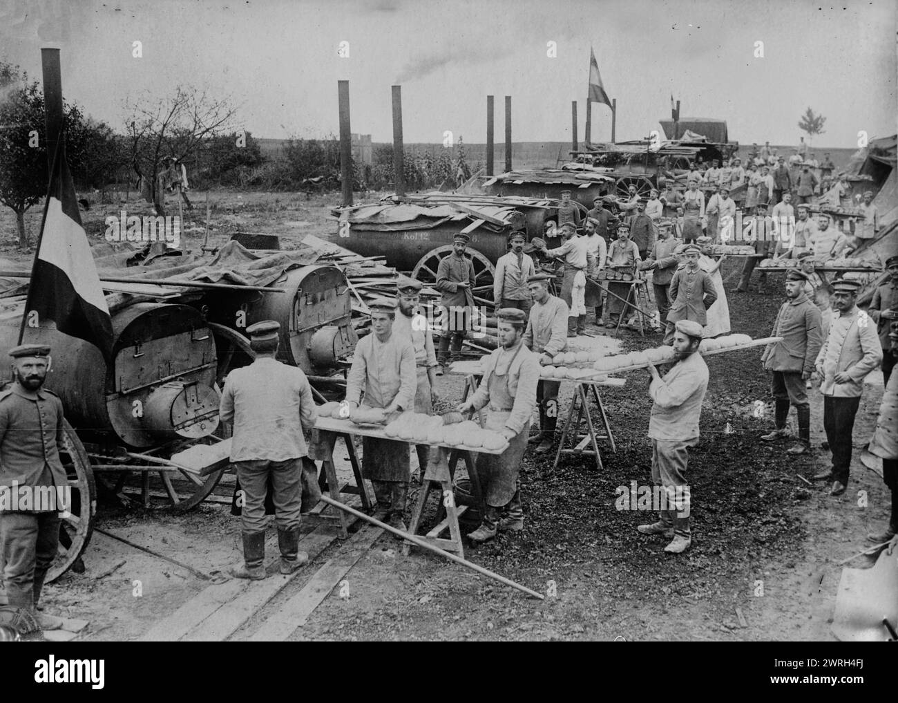 German field bakery near Ypres, 1914. Men cooking bread in mobile ovens near Ypres, Belgium during World War I. Stock Photo
