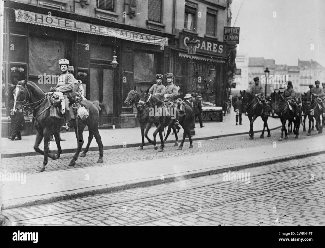 German Hussars in Antwerp, between c1914 and c1915. German Hussars on horses in the street in Antwerp, Belgium during World War I. Stock Photo