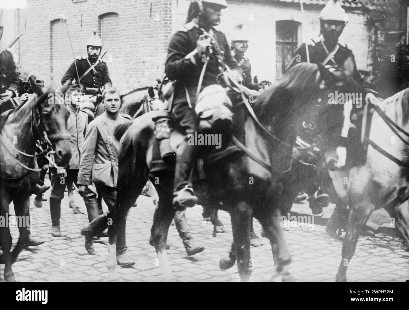 Uhlan prisoners at Guelzin, between c1914 and c1915. Possibly Polish prisoners of war surrounded by the French calvary during World War I. Stock Photo