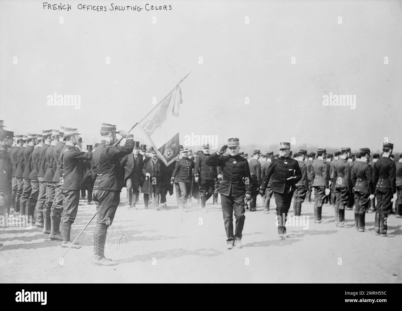 French officers saluting colors, between c1914 and c1915. Probably shows General Ferdinand Foch (1851-1929), who served in the French army during World War I. Stock Photo