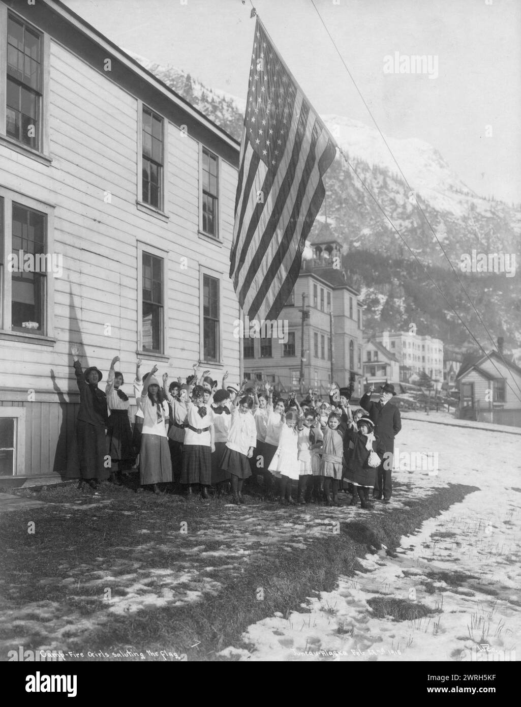 Camp-Fire Girls saluting the flag, 1915. Stock Photo