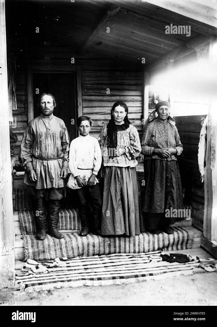 A peasant family from the village of Lovatskaya, Kansky district, 1905. This collection includes more than four hundred photographs of daily life in Yenisei Province in the late tsarist period. Photographs include peasants, Cossacks, and high-ranking officials. Krasnoiarsk Krai Museum of Regional History and Folklife Stock Photo