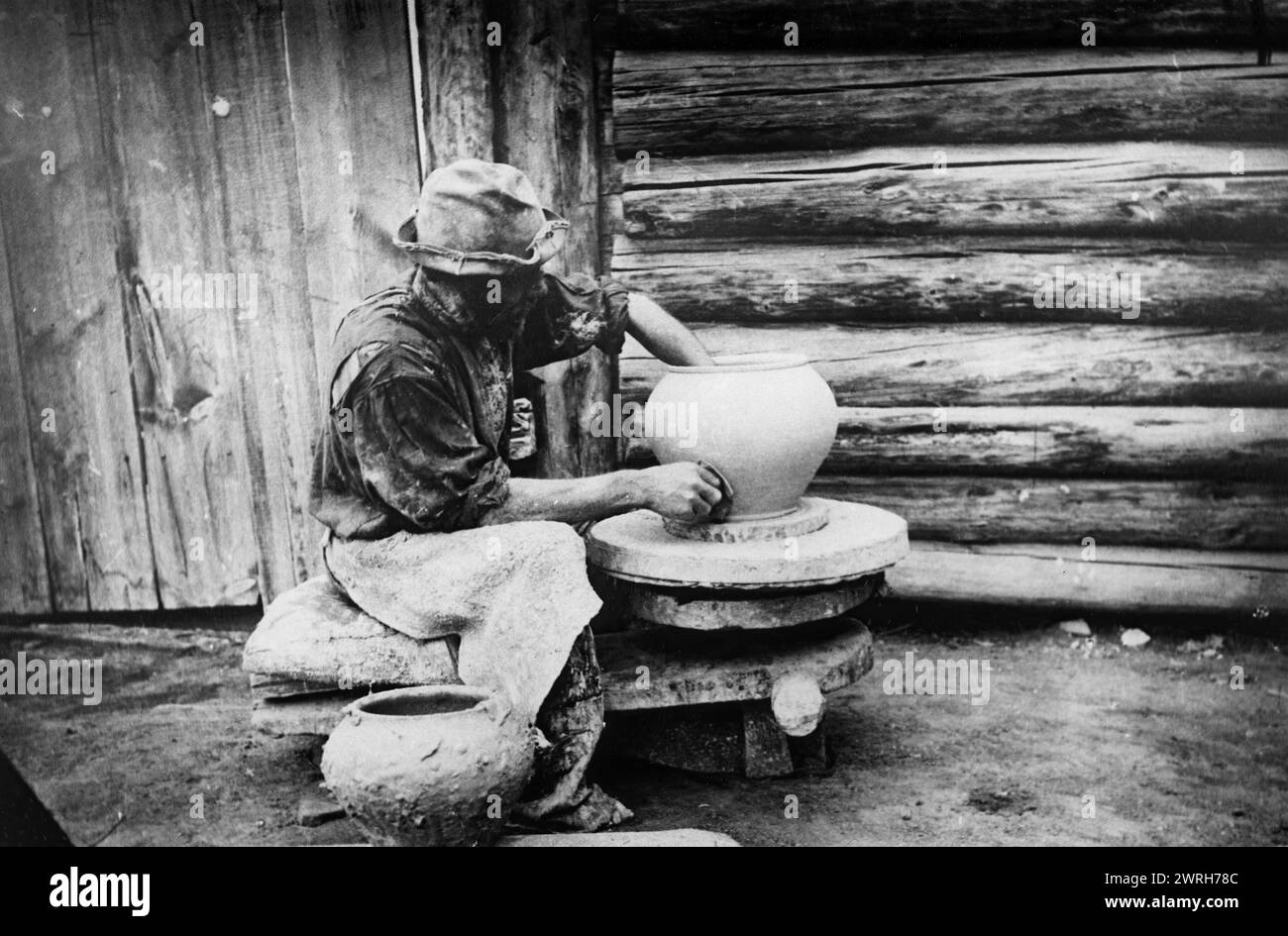 Handicraft potter from the village of Atamanovskoye, Krasnoyarsk district, 1900. This collection includes more than four hundred photographs of daily life in Yenisei Province in the late tsarist period. Photographs include peasants, Cossacks, and high-ranking officials. Krasnoiarsk Krai Museum of Regional History and Folklife Stock Photo