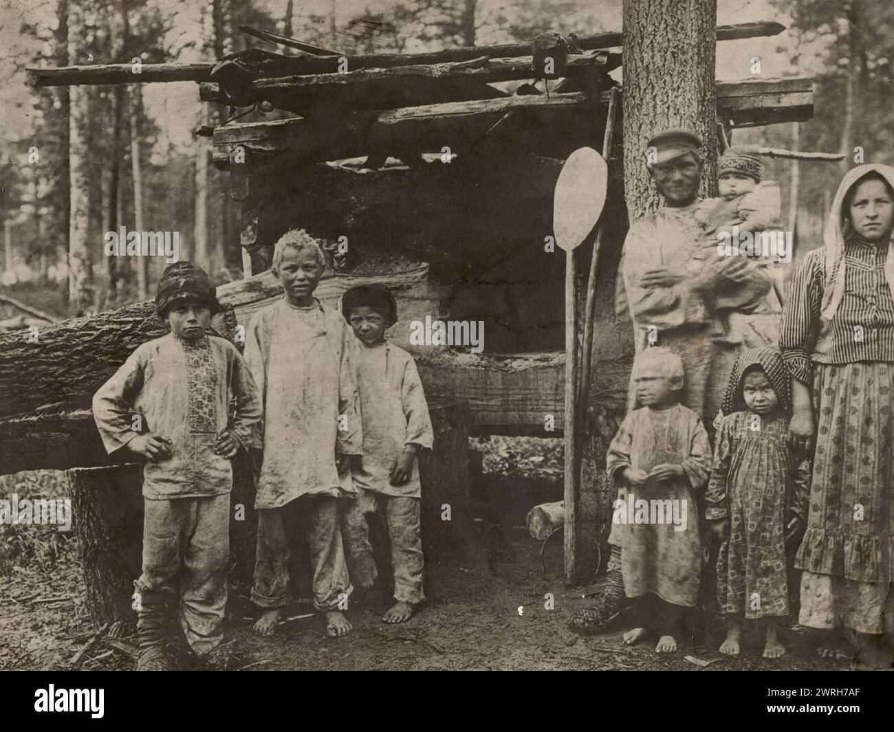 Settlers at their home, 1880. This collection includes more than four hundred photographs of daily life in Yenisei Province in the late tsarist period. Photographs include peasants, Cossacks, and high-ranking officials. Stock Photo