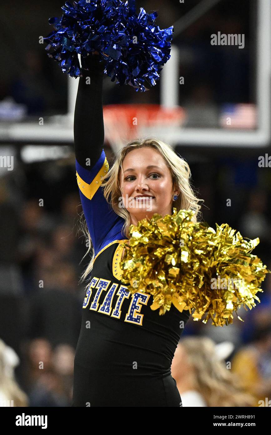 A South Dakota State cheerleader entertains the crowd during the women's final at the Summit League basketball tournament at the Denny Sanford Premier Center in Sioux Falls, South Dakota on Tuesday, March 12, 2024. South Dakota State wins the championship 67-54 over North Dakota State. Russell Hons/CSM. (Credit Image: © Russell Hons/Cal Sport Media) Stock Photo