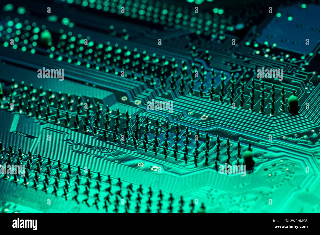 green computer motherboard. extreme closeup of electrical connections. Stock Photo