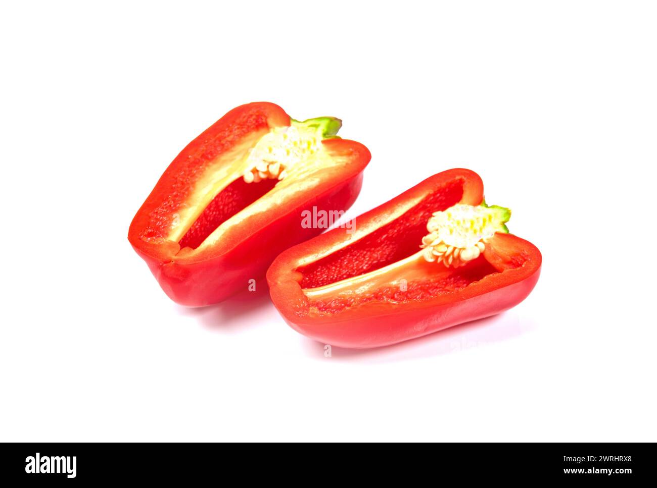 red sweet bell pepper half isolated on white background Stock Photo - Alamy