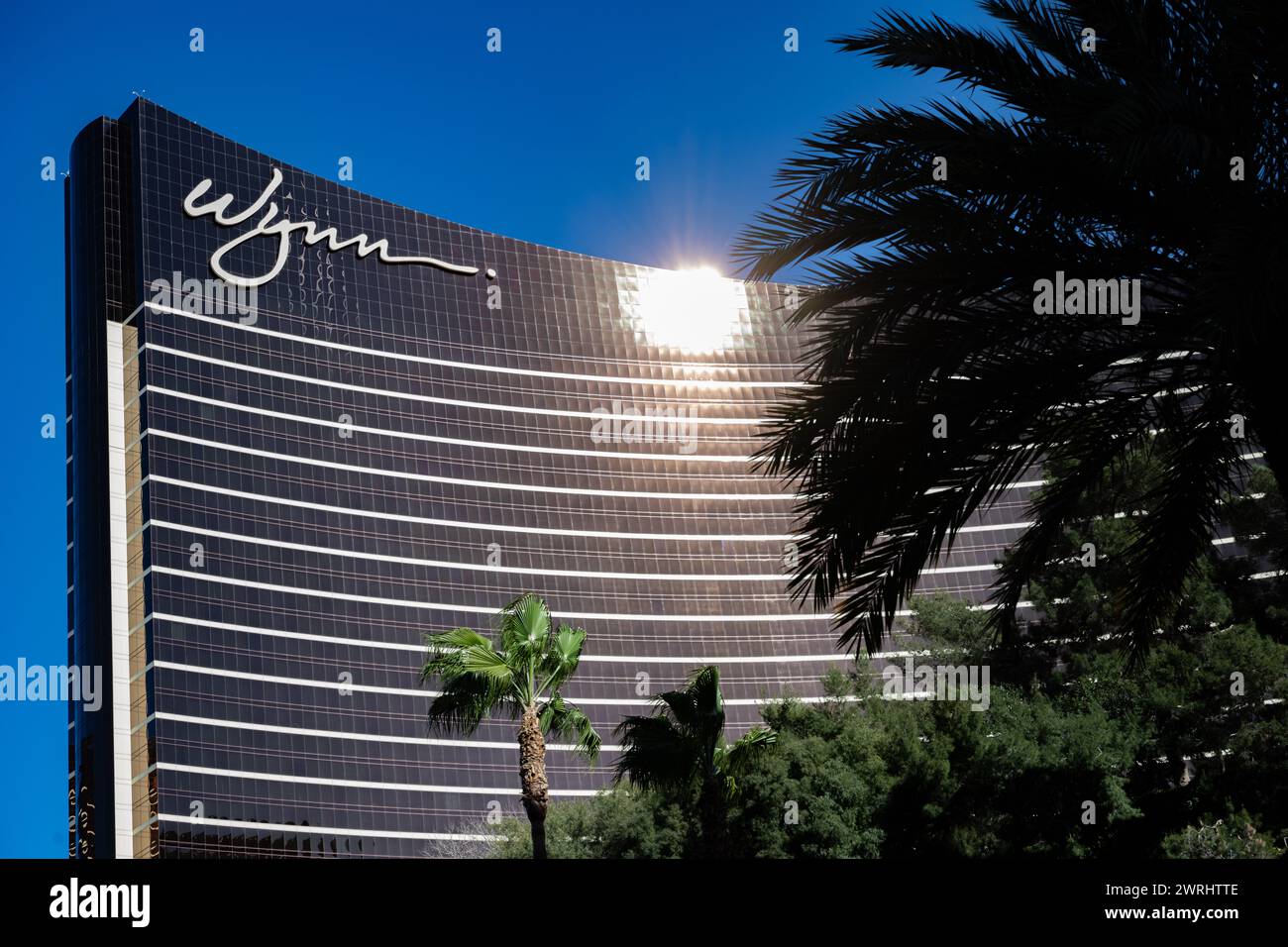 Wynn Las Vegas Casino day deep blue skies - sunny daylight exterior - close up of logo - gambling United States USA Stock Photo