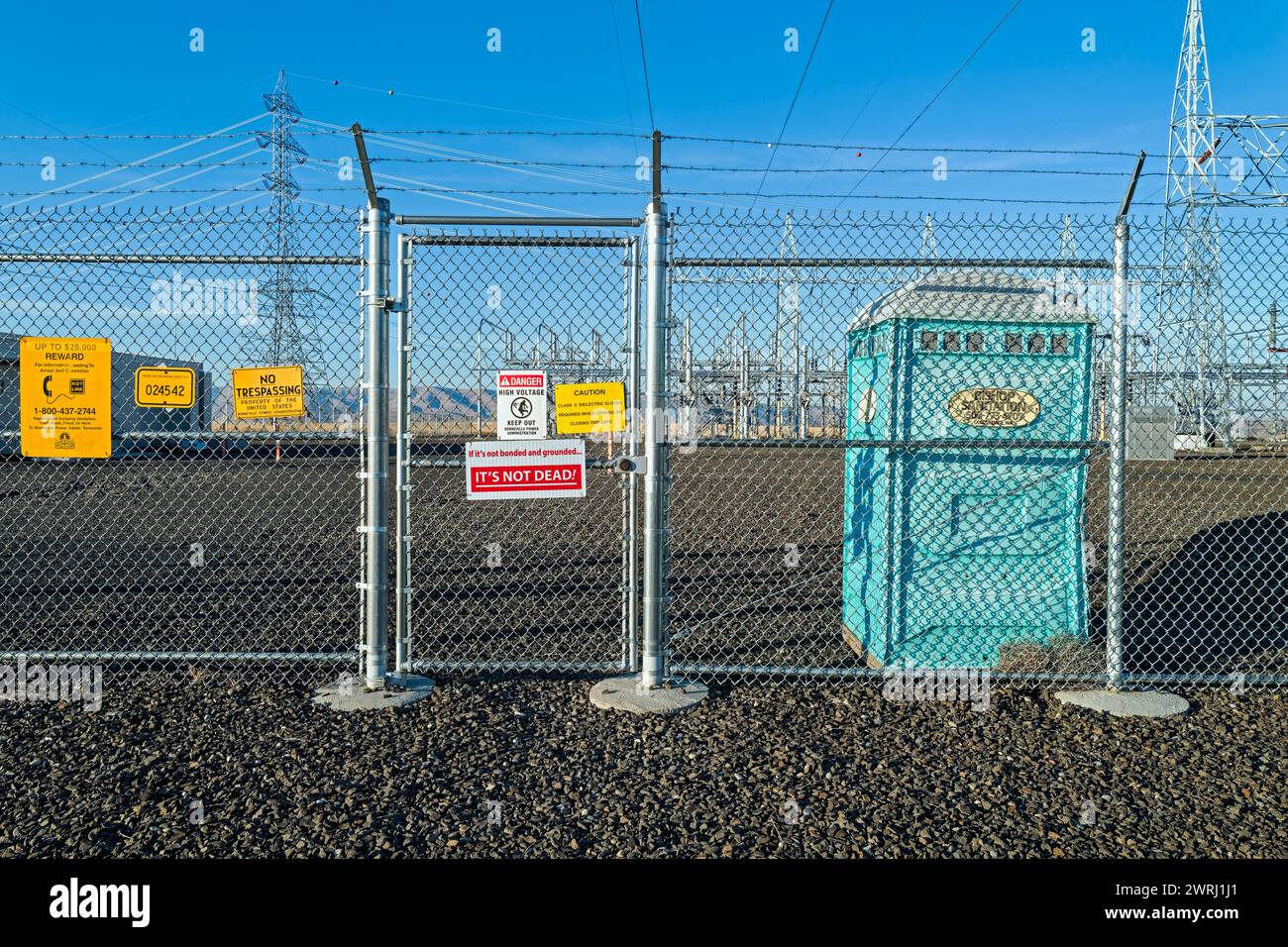 Warning signs posted on the fence at the electrical substation in