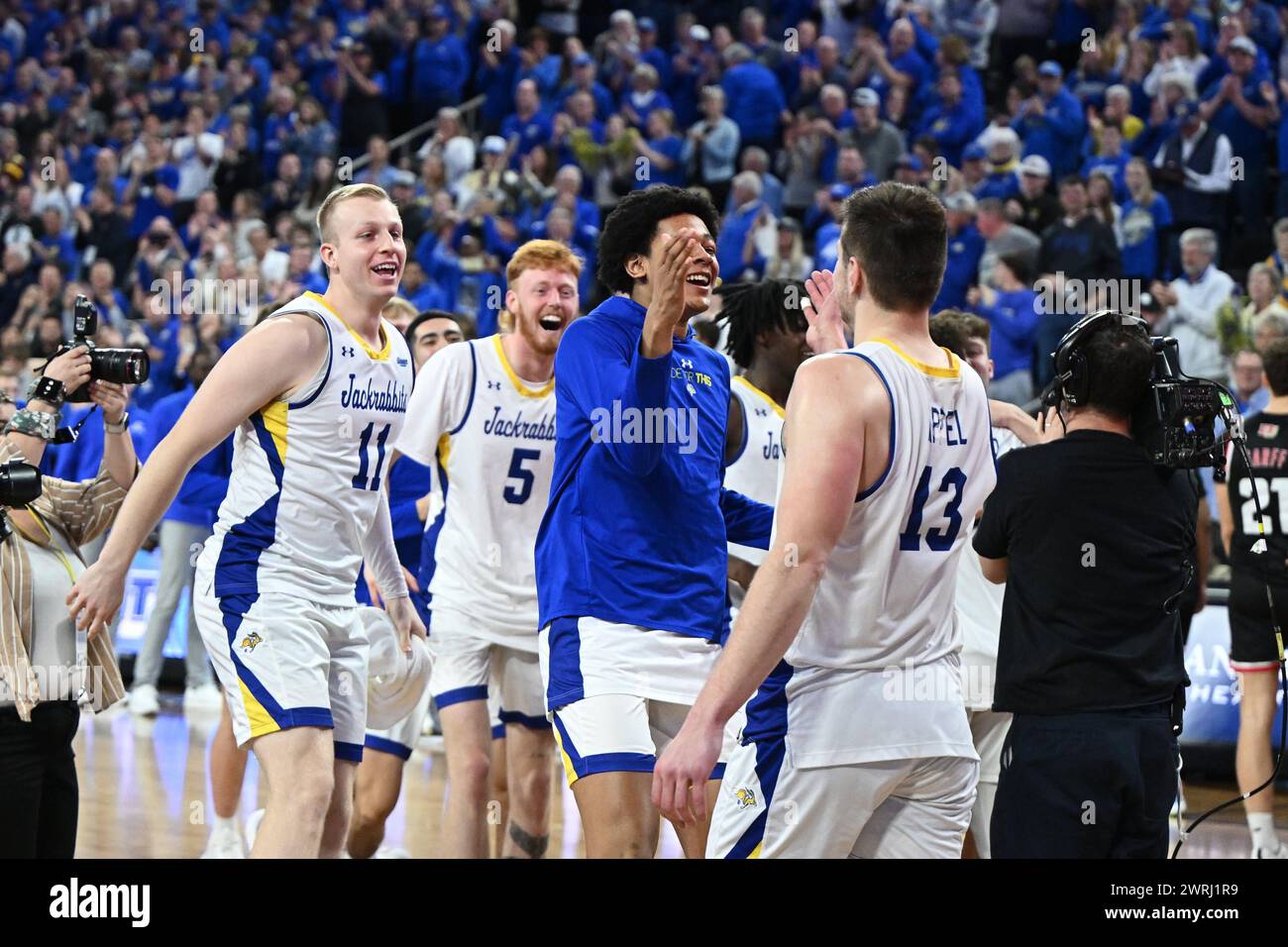 South Dakota State players celebrate winning the men's final at the