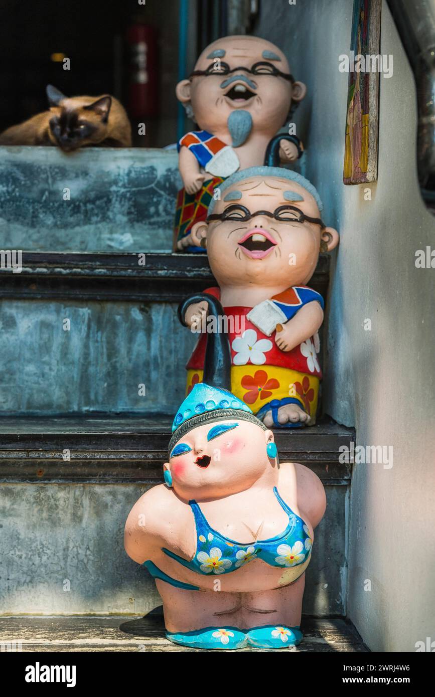 Clay Dolls as Asian garden decoration, woman, female, figure, fat, bikini, toys, doll, garden gnome, decoration, whimsical, funny, funny, kissing Stock Photo