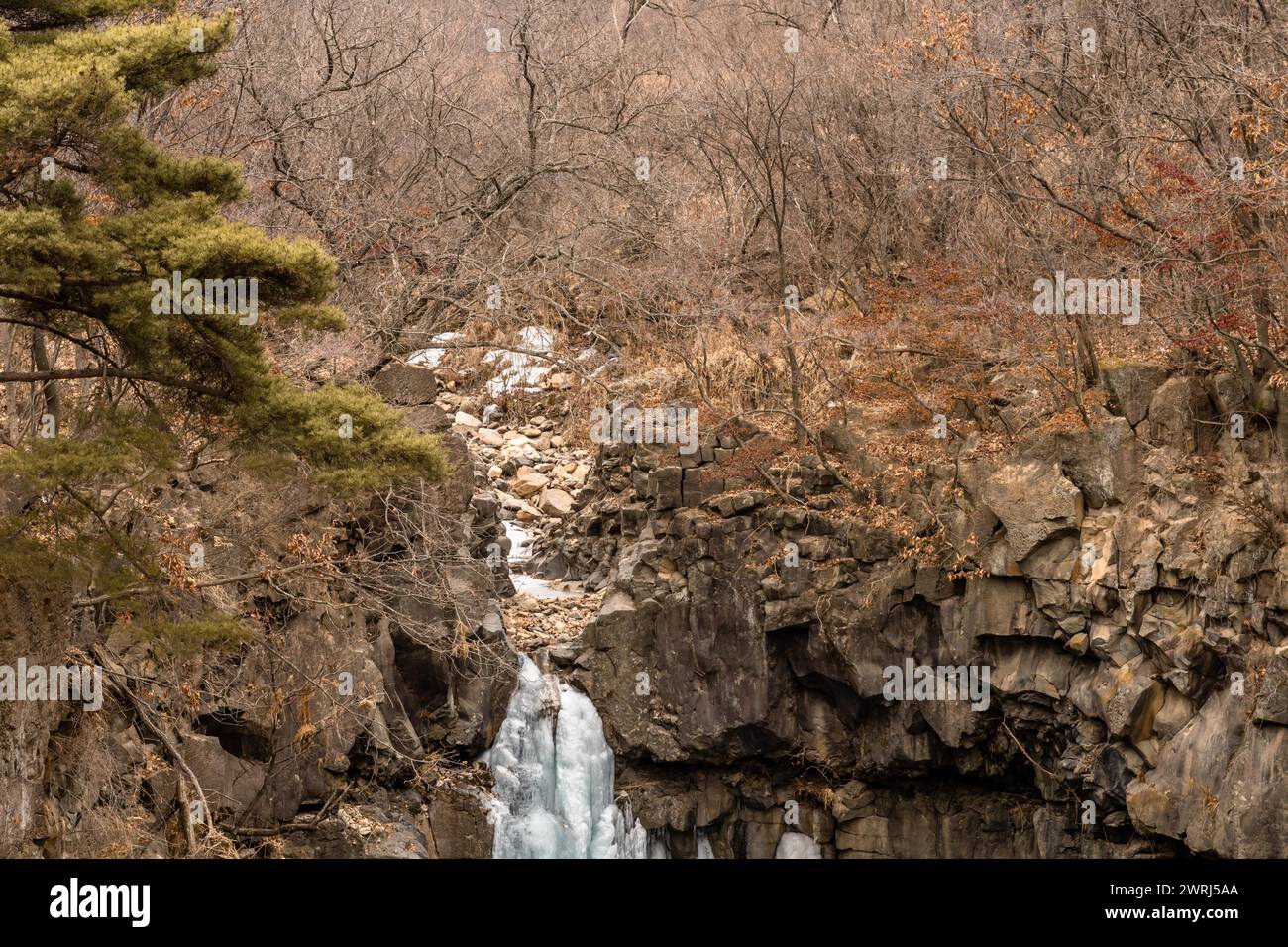 Winter landscape of dry riverbed that feeds Jaein waterfall in Gyeonggi province, South Korea Stock Photo