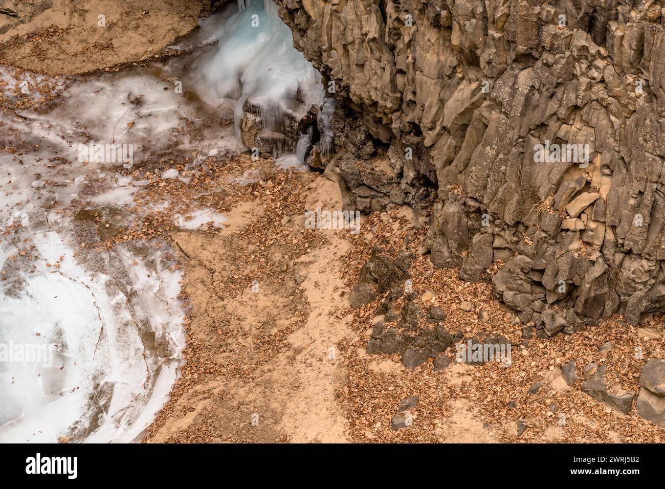 View of bottom of crater with ice flow and edge of frozen pond in Gyeonggi province of South Korea Stock Photo