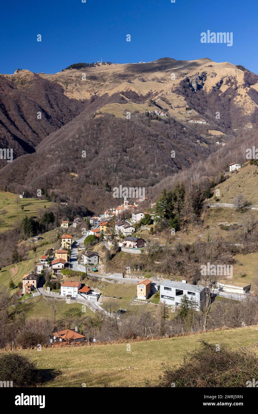 Village view of Muggio, Monte Generoso peak in the background, Valle di Muggio, Ticino, Switzerland Stock Photo