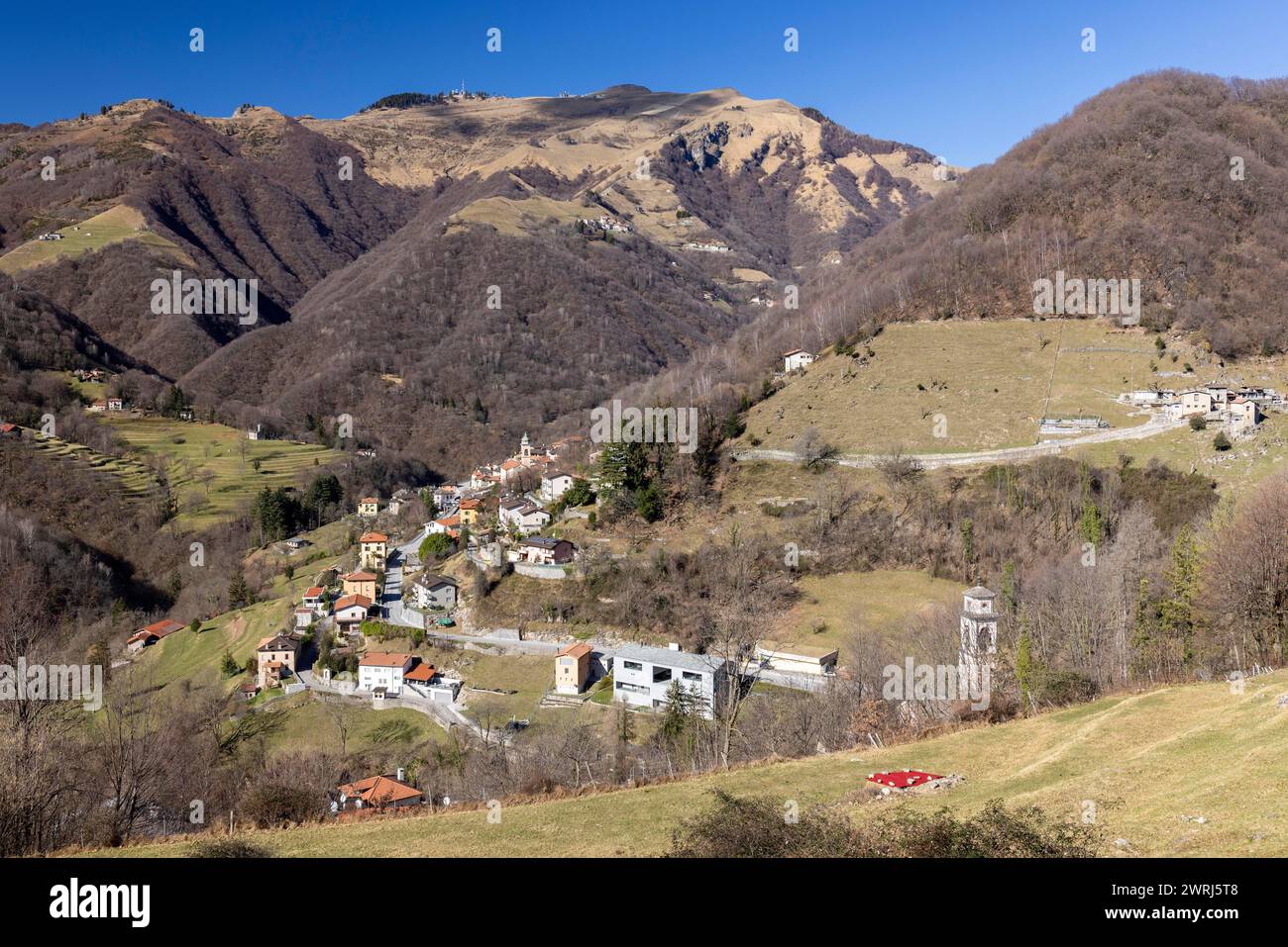 Village view of Muggio, Monte Generoso peak in the background, Valle di ...