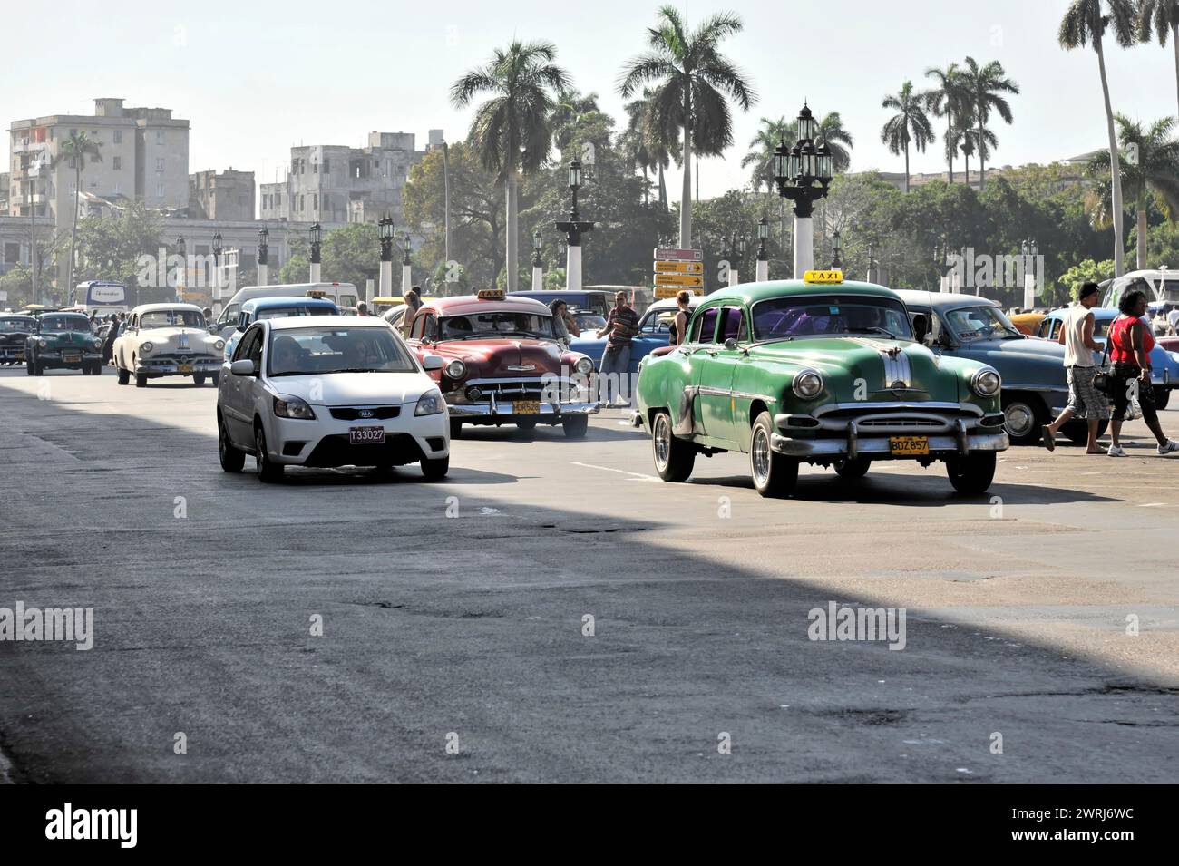 A city street with a mix of vintage and modern cars by day, Havana, Cuba, Central America Stock Photo