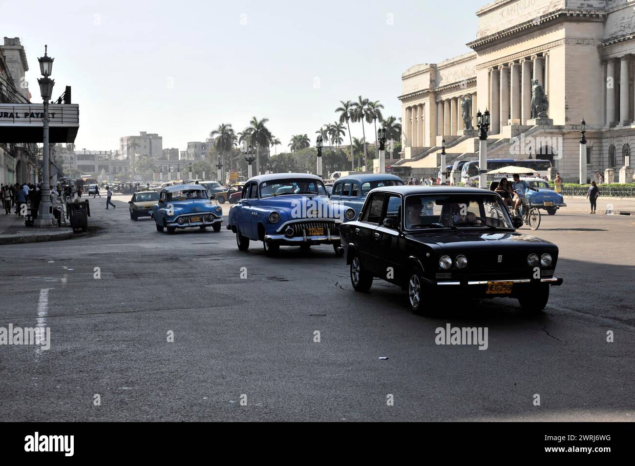 Vintage car in city traffic in front of historic capitol-style building, Havana, Cuba, Central America Stock Photo