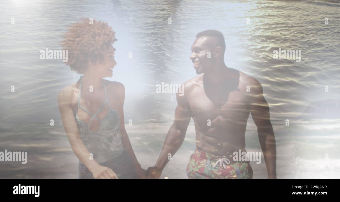 Image of happy african american couple at beach over sea Stock Photo ...