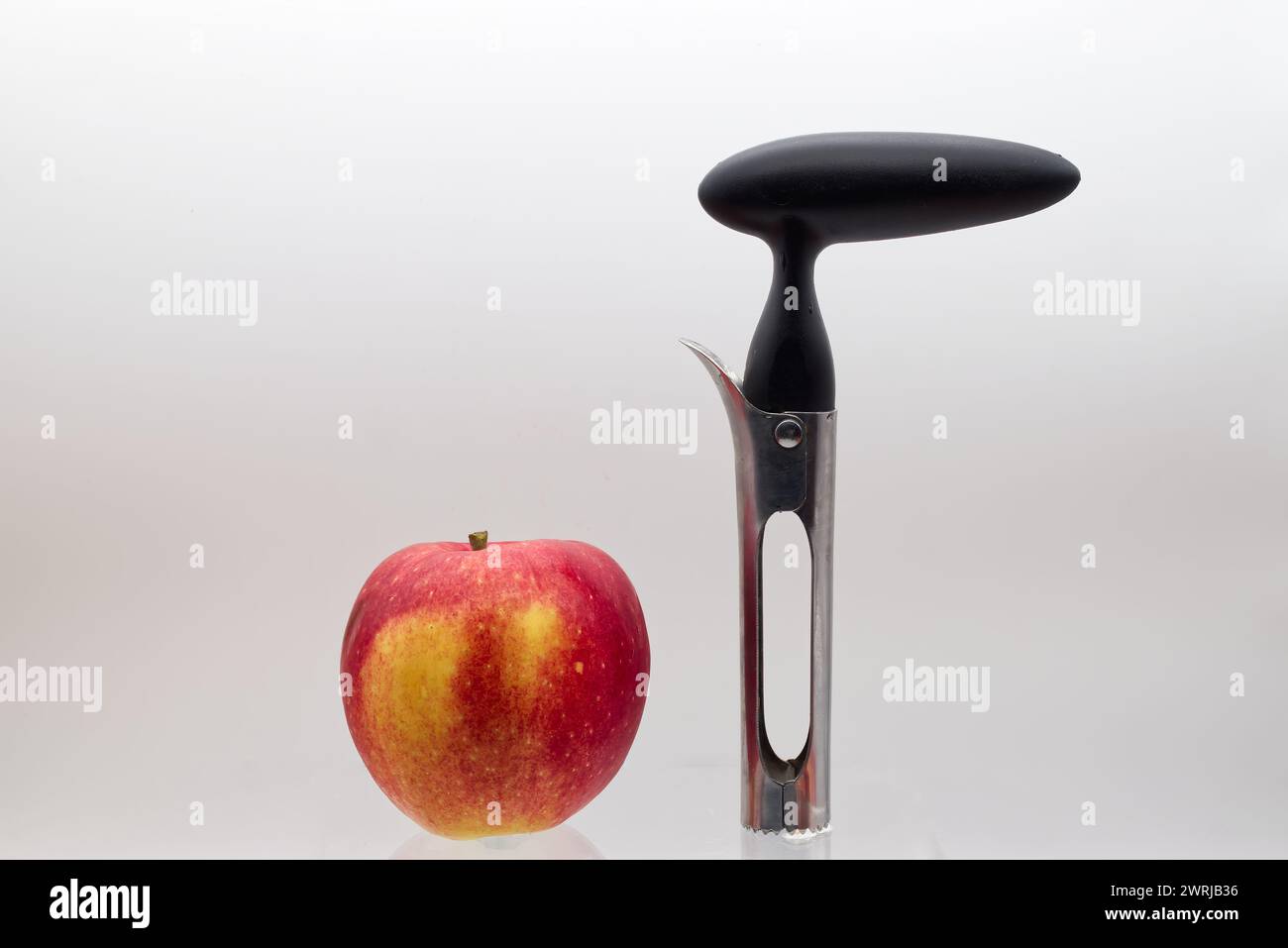 Apple corer. Tool for removing the apple core, isolated on white background. Stock Photo