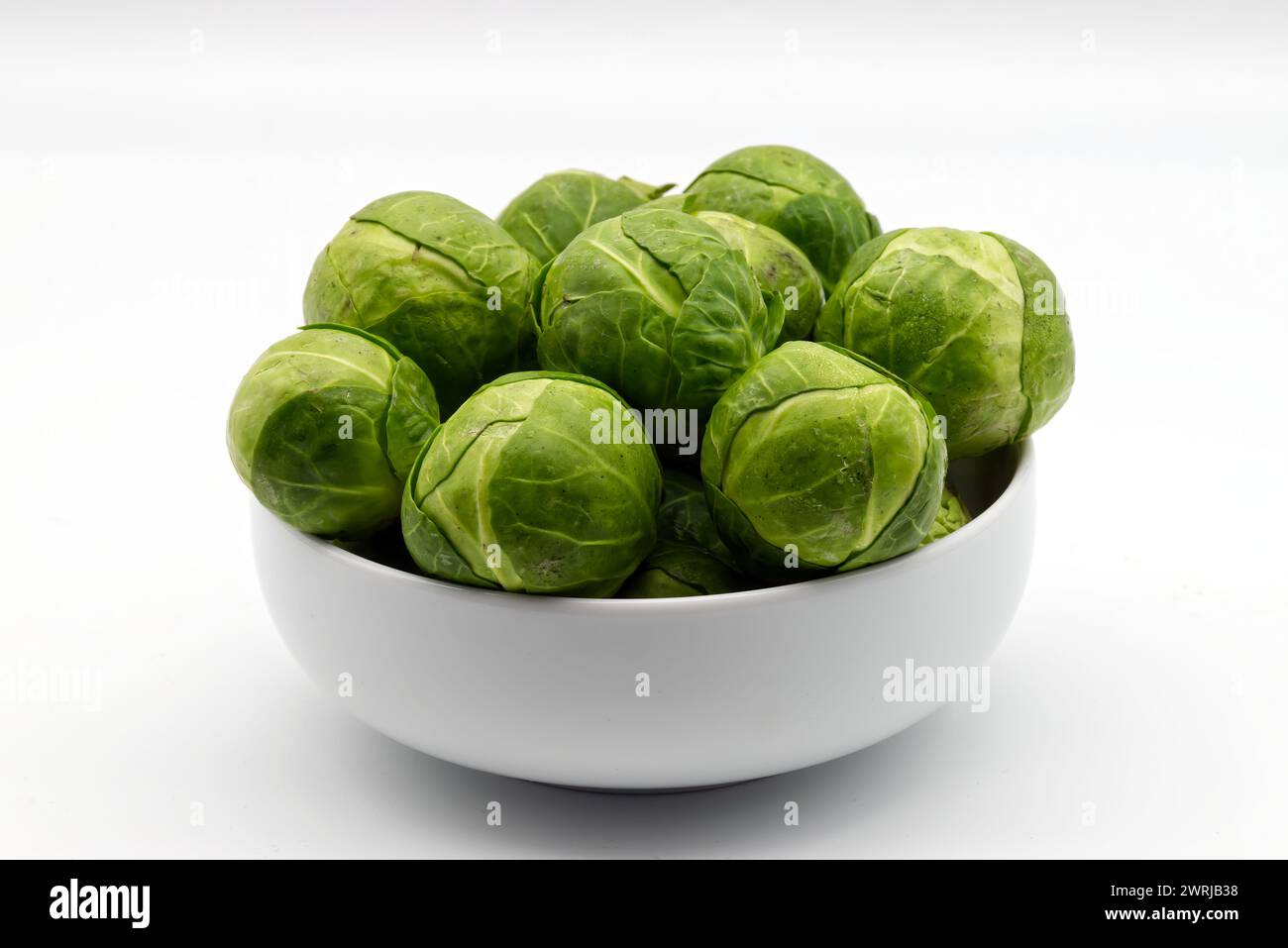 Fresh Brussels sprouts isolated on white background. Stock Photo