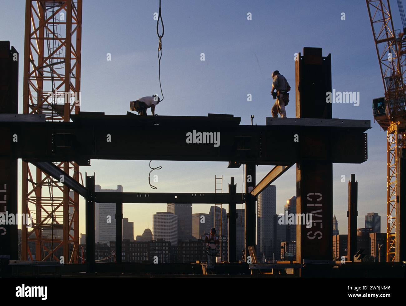 usa boston massachusetts skeleton building workers fixing steel piles Stock Photo