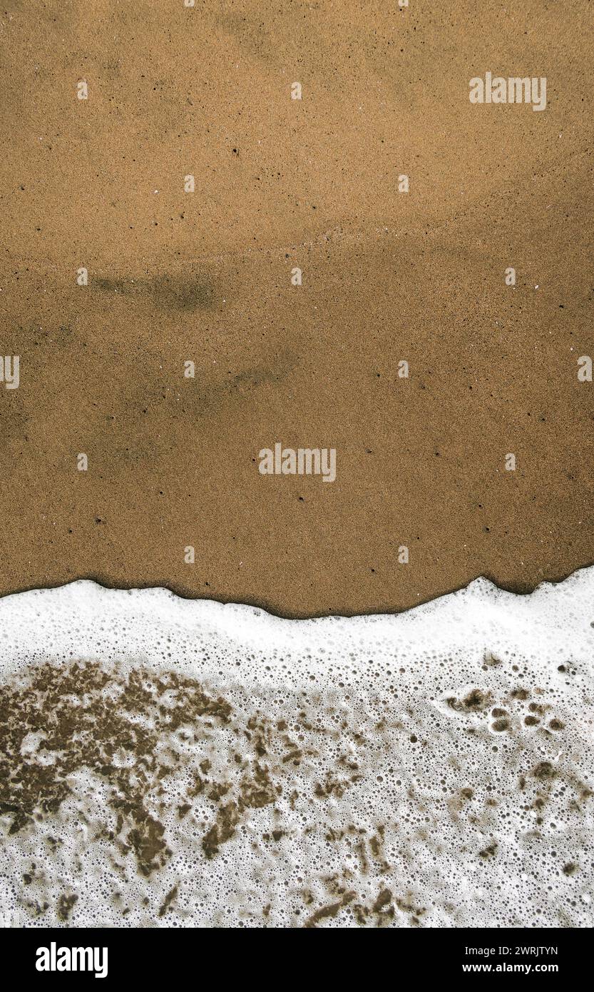 Sea foam on the beach hi-res stock photography and images - Alamy