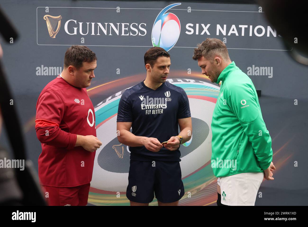 L-R England's Jamie George (Saracens) Referee Nika Amashukeli toss the coin and Peter O'Mahony of Ireland (Munster)  before kick off during Guinness 6 Stock Photo