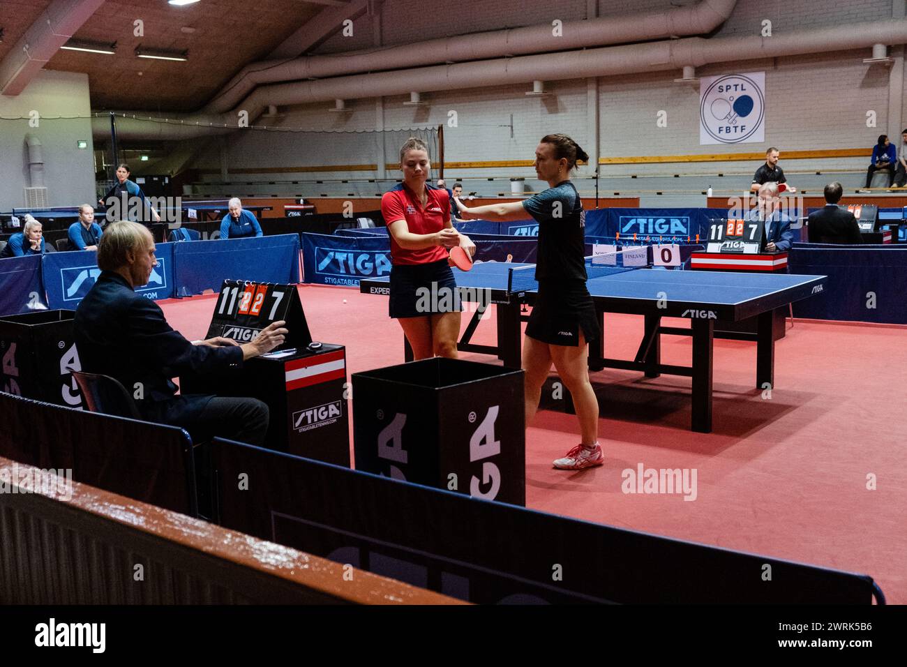 Hand shakes at the end of the match. Anna KIRICHENKO of Finland (blue) plays Rebekka CARLSON of Norway (red). Action from the women's international matches art the Finland v Norway European Table Tennis Championships Qualification Group (for the 2023 European tournament) in Helsinki, 17 October 2022. Stock Photo