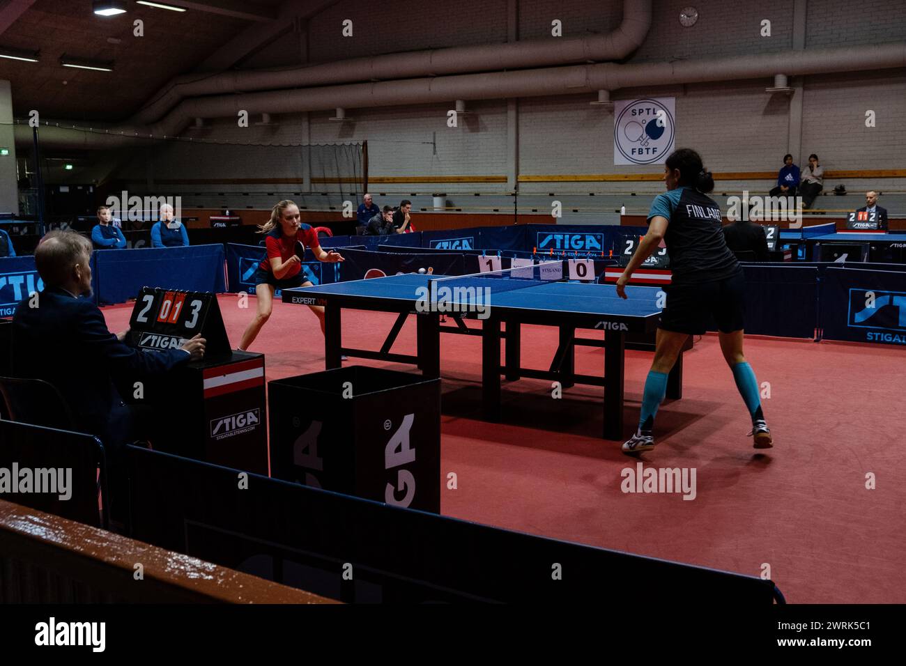 Marina Donner of Finland (blue) plays Rikke Skåttet of Norway (red). Action from the women's international matches art the Finland v Norway European Table Tennis Championships Qualification Group (for the 2023 European tournament) in Helsinki, 17 October 2022. Stock Photo