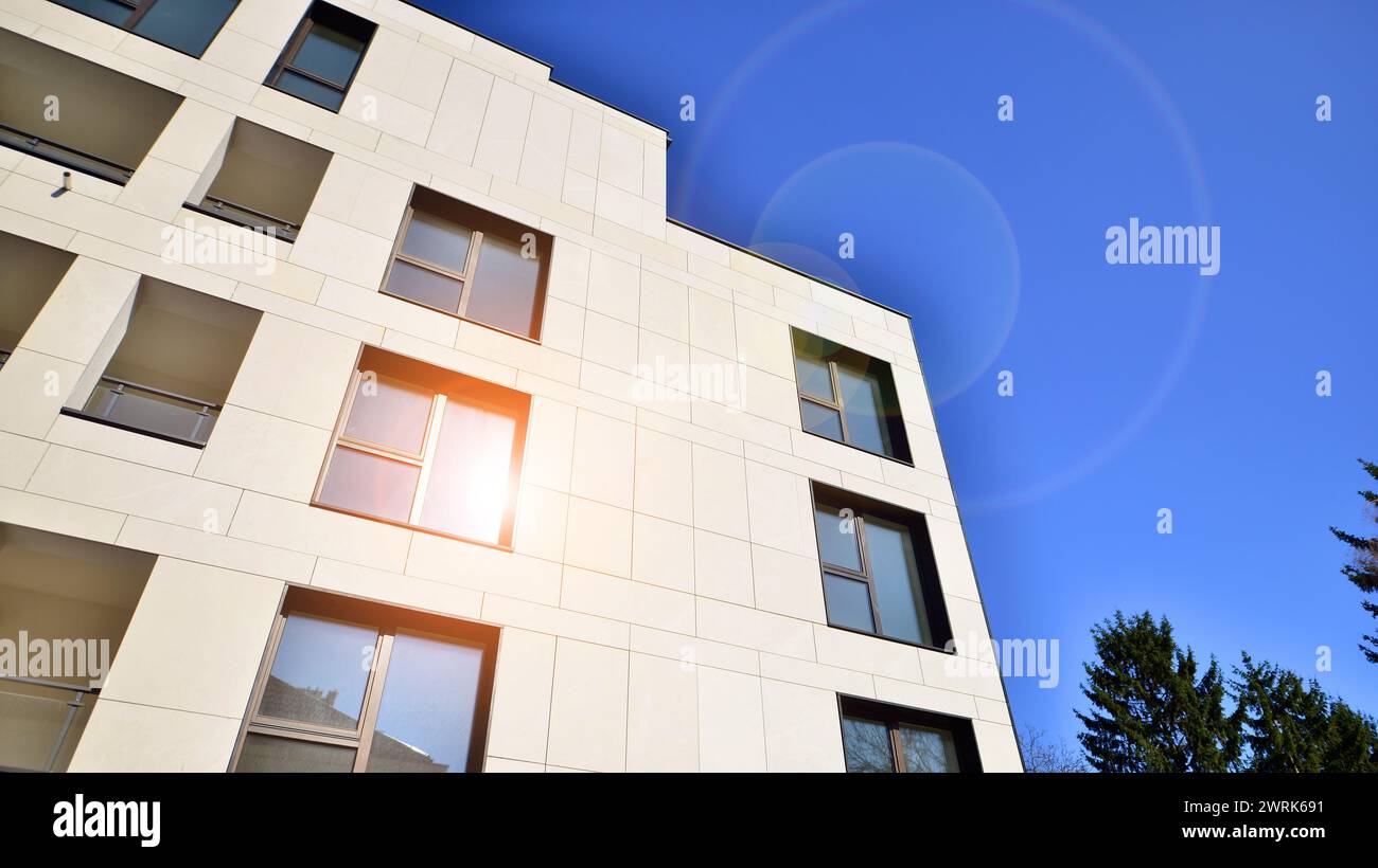 View of a white modern apartment building. Perfect symmetry with blue ... - Apartment Renovation With A Perfect Symmetry