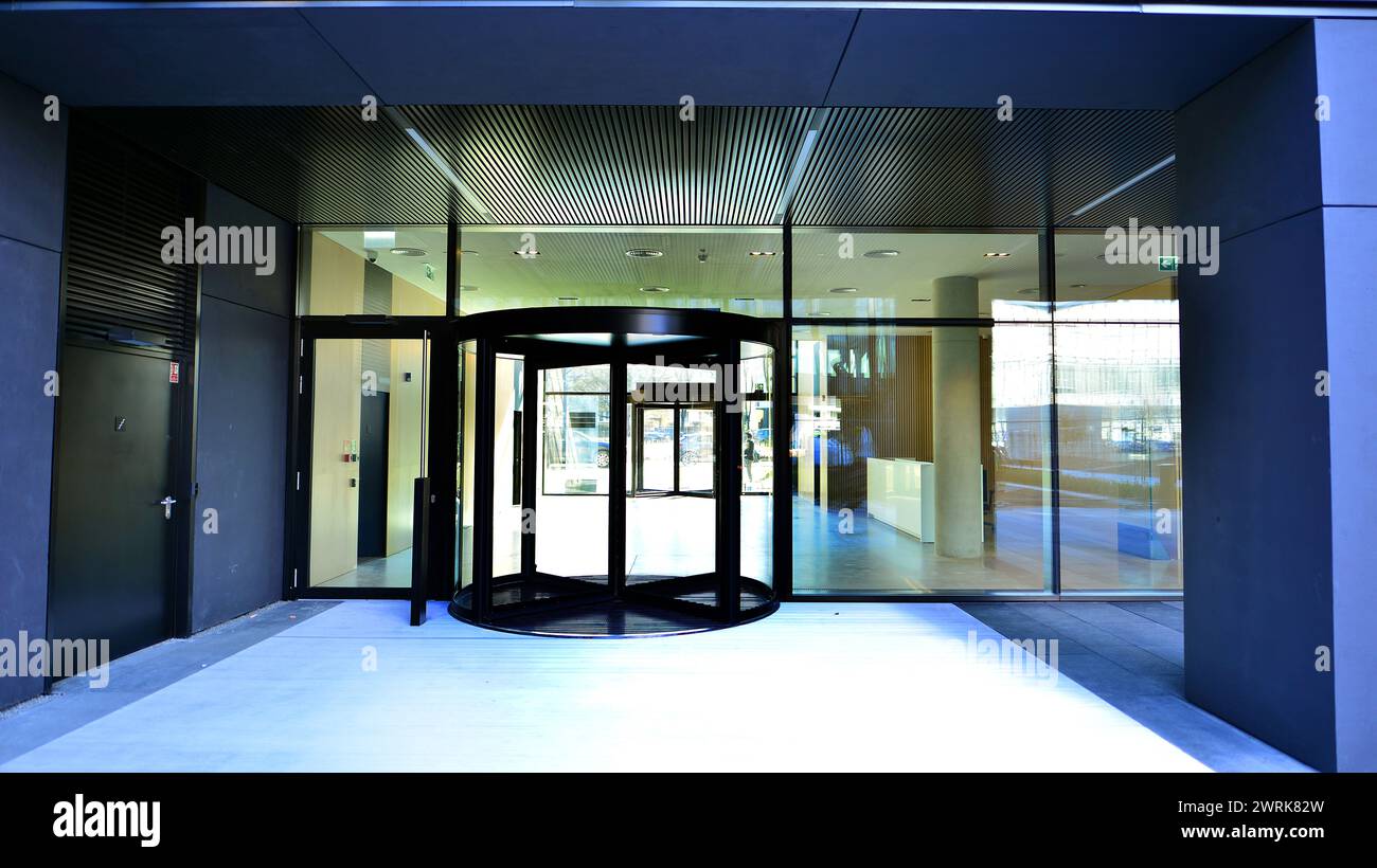 Entrance Of The Modern Business City Office Building Modern Urban Entrance Of The Modern Business City Office Building Modern Urban Architecture The Front Door Of A Office Block Reflecting Buildings In The Glass 2WRK82W