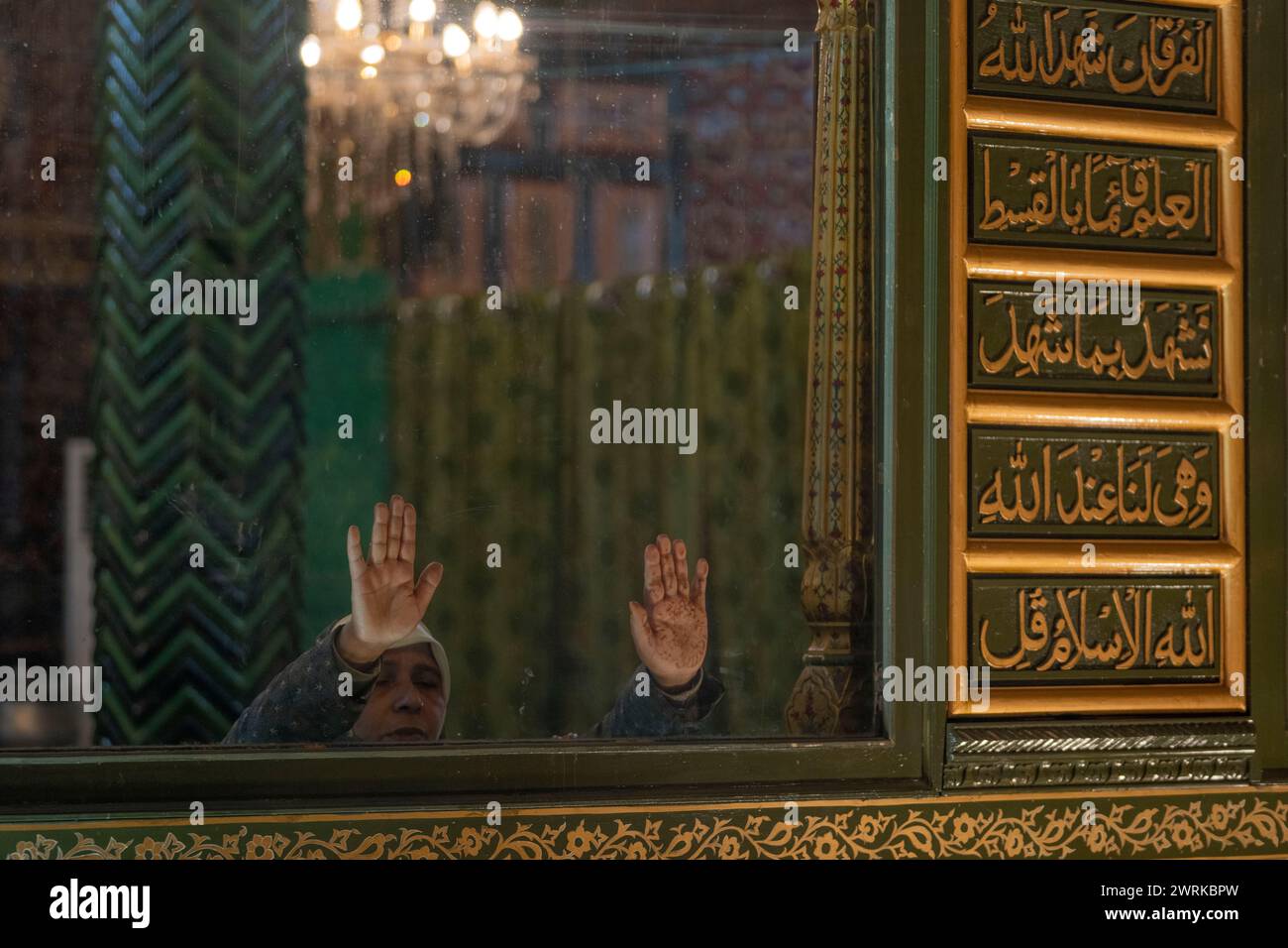 A Kashmiri Muslim woman prays inside the shrine of Sufi saint Shiekh ...