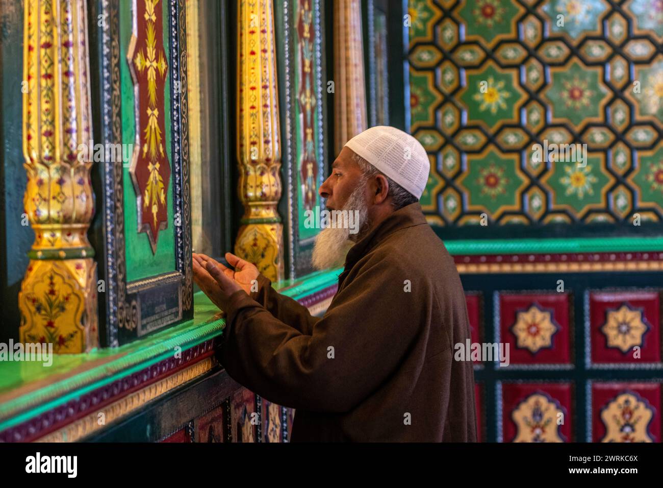A Kashmiri man prays inside the shrine of Sufi saint Shiekh Abdul Qadir ...