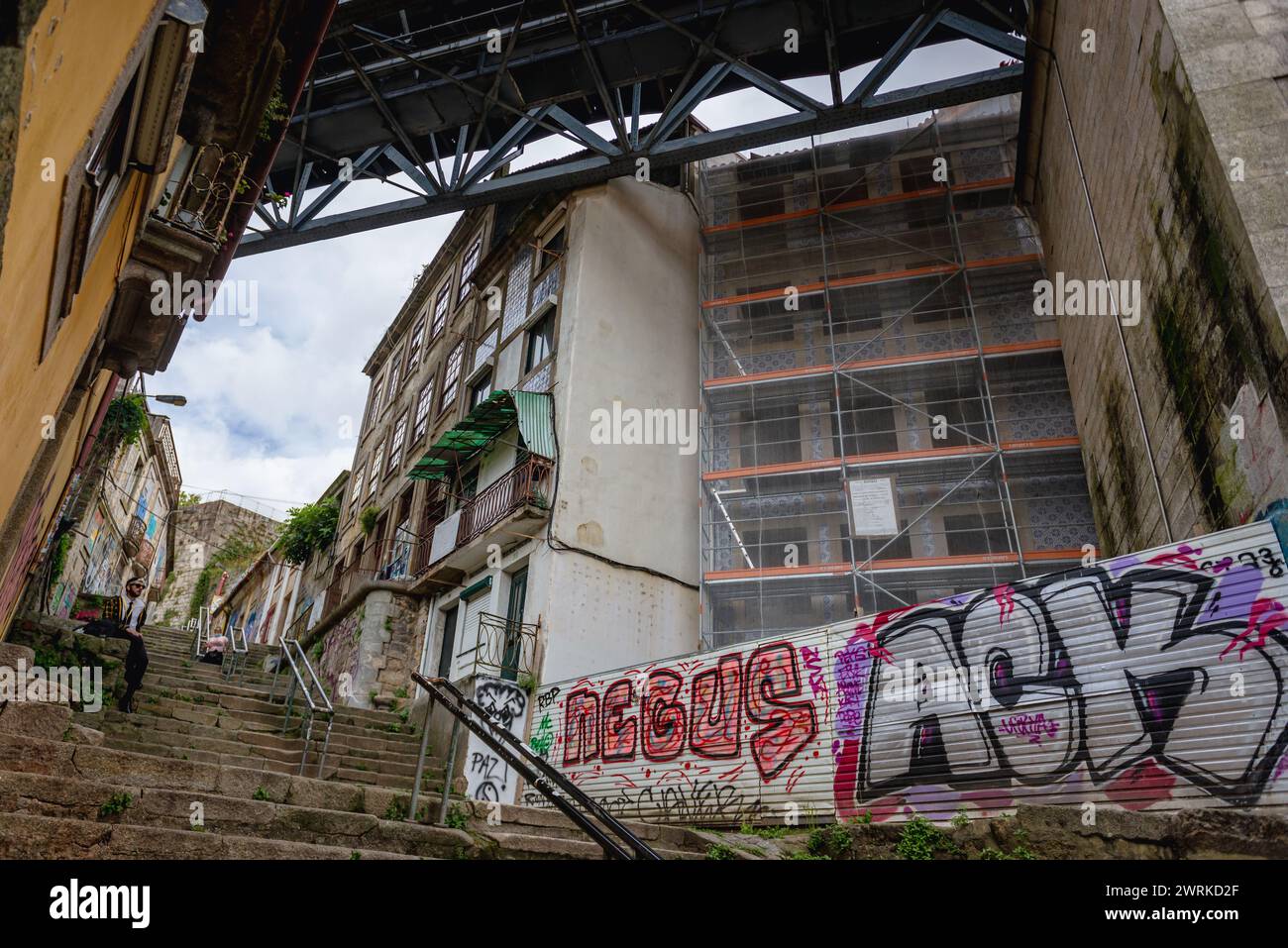 Tenements under the Dom Luis I Bridge on Escadas do Codecal stairs in ...
